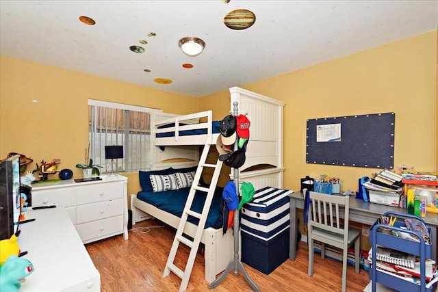 bedroom with wood-type flooring