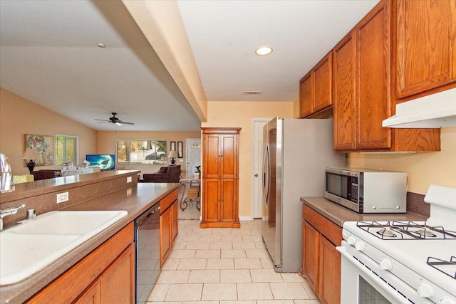 kitchen featuring ceiling fan, sink, light tile patterned flooring, and appliances with stainless steel finishes