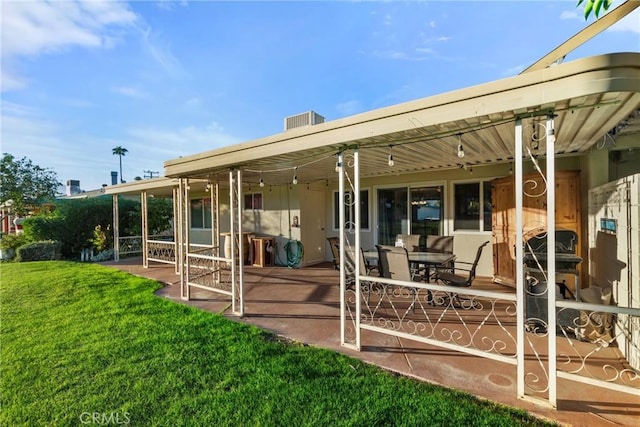 back of property with a yard