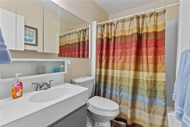 full bathroom featuring shower / bath combo, vanity, and toilet