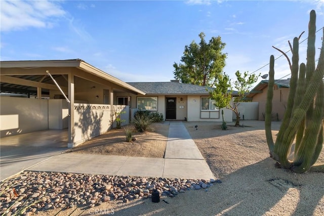 ranch-style home with a carport
