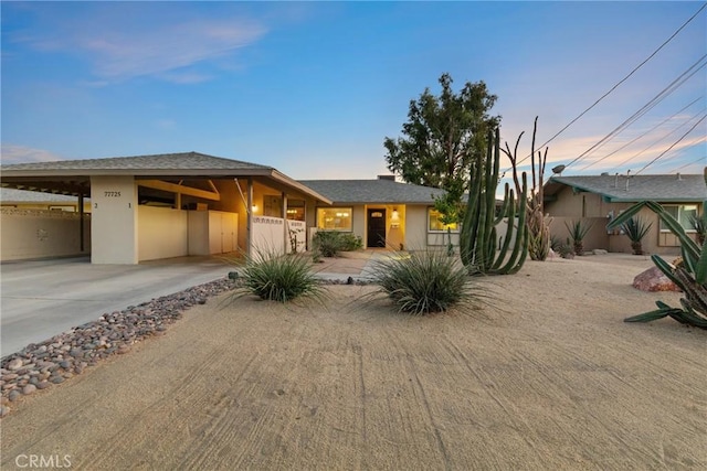 view of front of house with a carport
