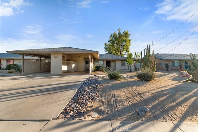 view of front of property with a carport