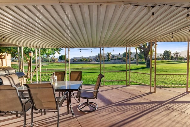 deck featuring a lawn, area for grilling, and a patio