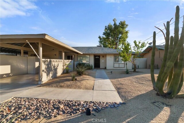 ranch-style house with a carport