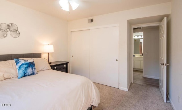 carpeted bedroom featuring a closet