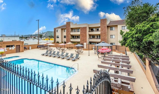 view of pool featuring a patio area