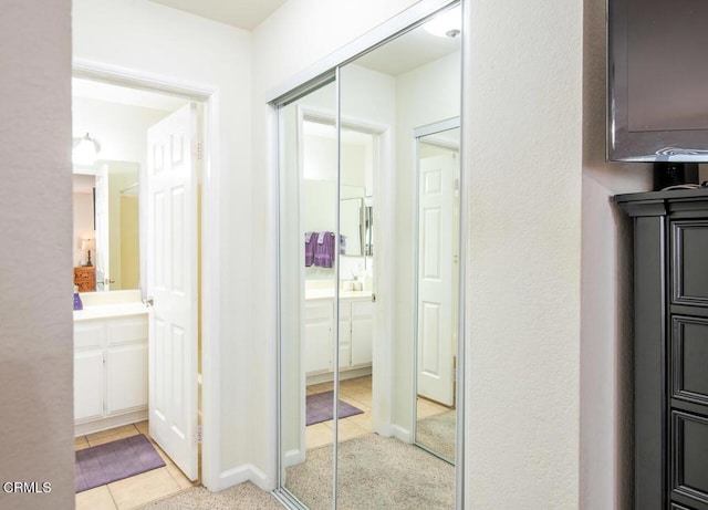 bathroom featuring tile patterned flooring and vanity