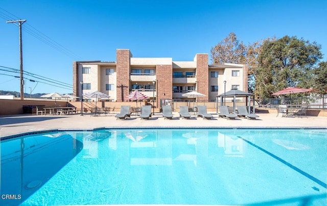 view of pool with a gazebo and a patio