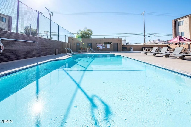 view of swimming pool featuring a patio area