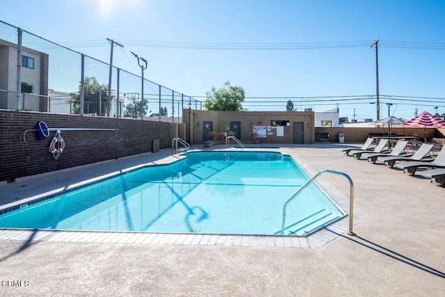 view of swimming pool with a patio area