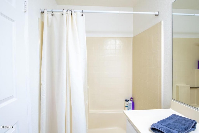 bathroom with vanity and shower / tub combo