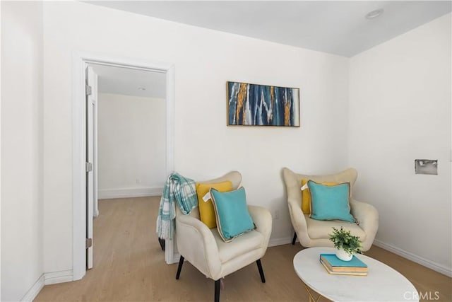 living area with light hardwood / wood-style floors