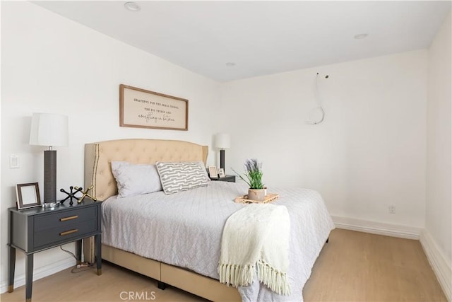 bedroom with wood-type flooring