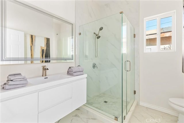 bathroom featuring vanity, toilet, and walk in shower