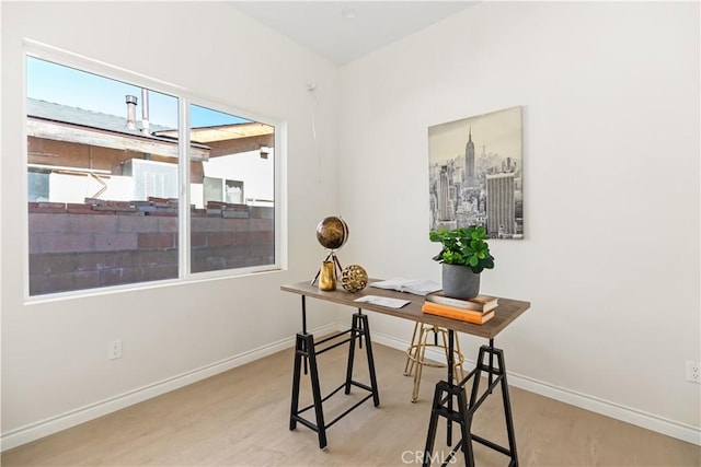 home office featuring light hardwood / wood-style floors