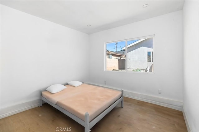 bedroom featuring hardwood / wood-style flooring