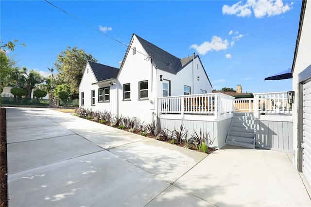 view of property exterior featuring a deck