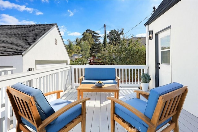 wooden deck featuring an outdoor living space