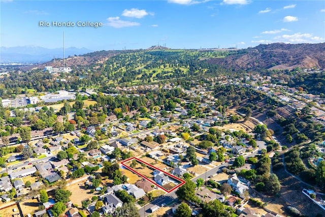 birds eye view of property with a mountain view