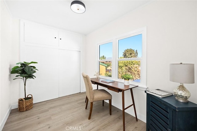 office with light hardwood / wood-style floors