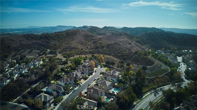 birds eye view of property with a mountain view