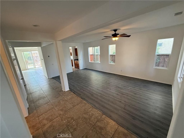 empty room featuring dark hardwood / wood-style flooring and ceiling fan