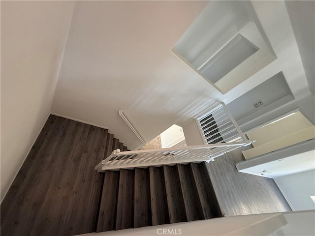 stairway featuring hardwood / wood-style floors