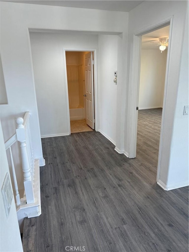 unfurnished living room with dark hardwood / wood-style flooring