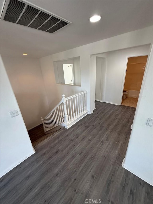 empty room with dark hardwood / wood-style floors