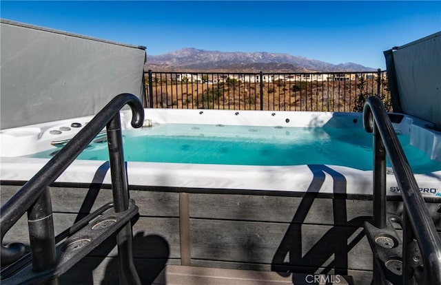 view of swimming pool featuring a mountain view