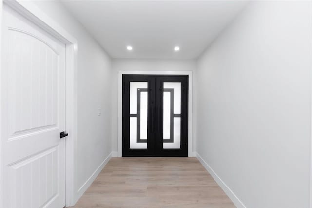 foyer with light hardwood / wood-style flooring