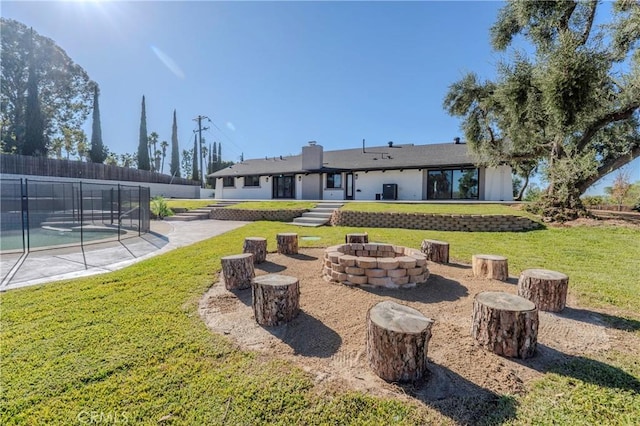 view of yard with a fire pit