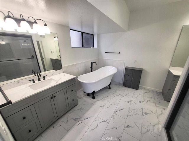 bathroom with a tub to relax in and vanity