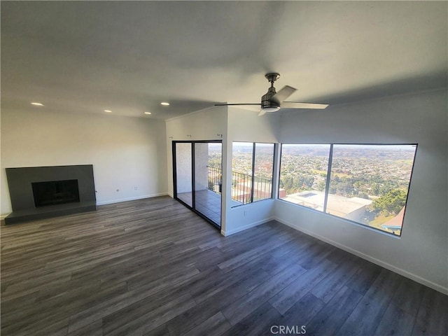 unfurnished living room with lofted ceiling, dark wood-type flooring, and ceiling fan