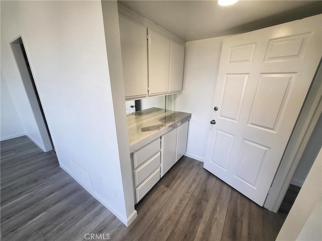 interior space with dark hardwood / wood-style flooring