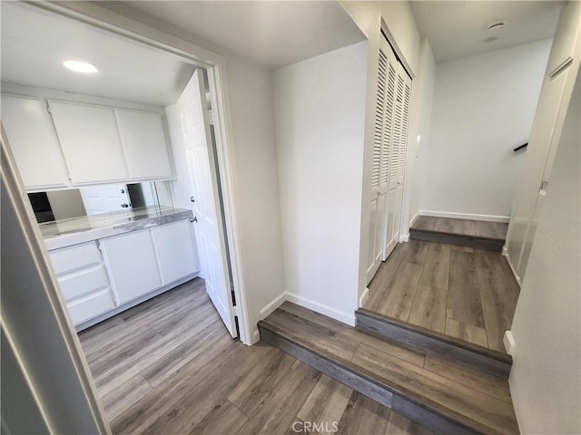 corridor featuring light hardwood / wood-style flooring