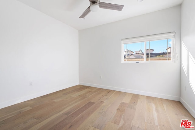 unfurnished room featuring ceiling fan and light hardwood / wood-style flooring