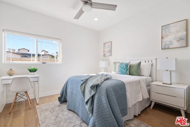 bedroom featuring ceiling fan and light hardwood / wood-style flooring