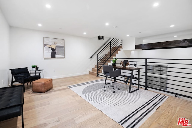 office space with light wood-type flooring