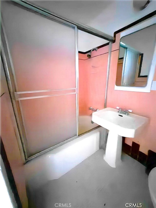 full bathroom featuring shower / bath combination with glass door and toilet