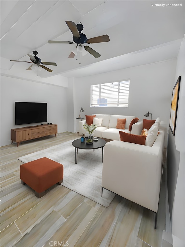 living room with ceiling fan and light wood-type flooring