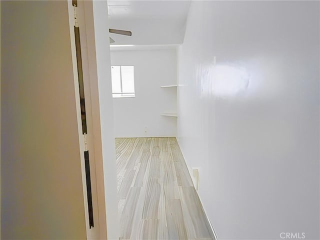 hall with wood finished floors