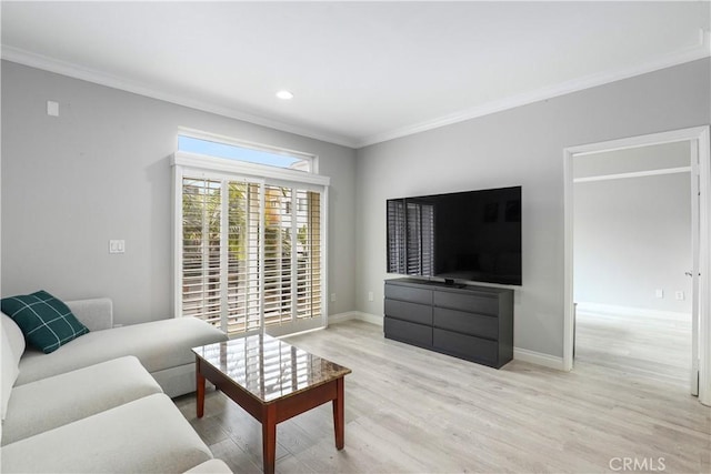 living room with crown molding and light wood-type flooring