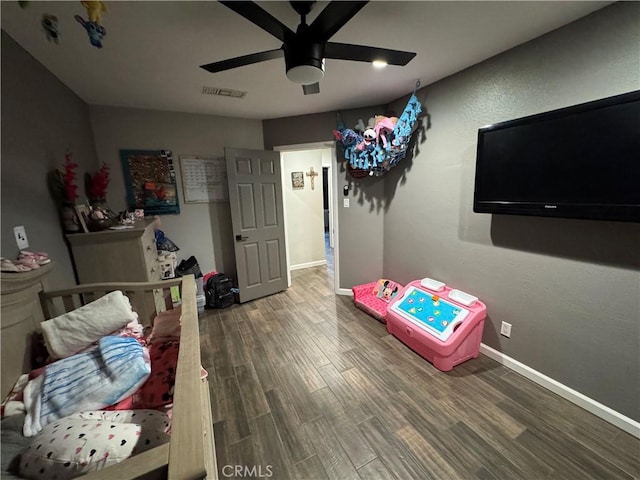 bedroom featuring hardwood / wood-style flooring and ceiling fan