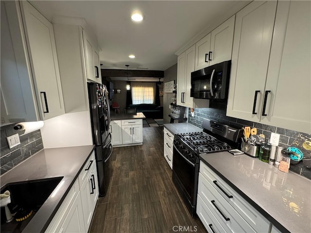 kitchen with black appliances, white cabinets, dark wood-type flooring, and tasteful backsplash