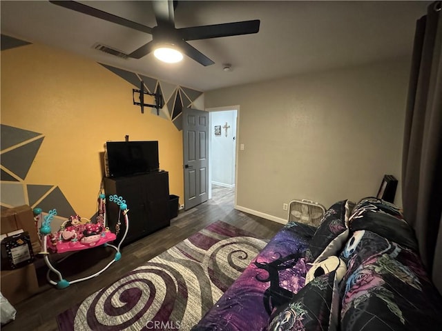 interior space with ceiling fan and dark wood-type flooring