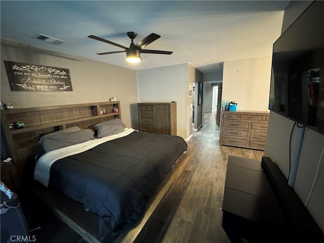 bedroom with hardwood / wood-style flooring and ceiling fan