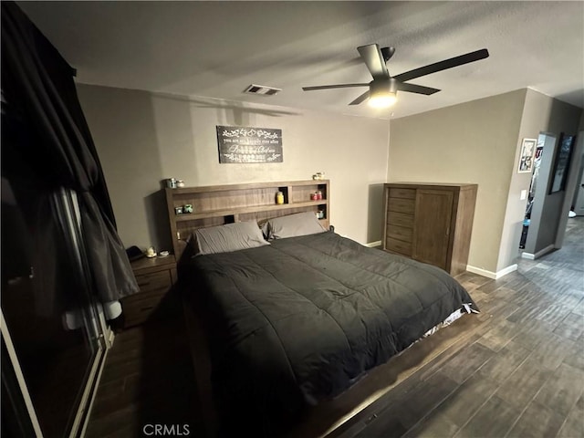 bedroom featuring dark hardwood / wood-style flooring and ceiling fan