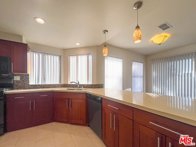 kitchen featuring sink, backsplash, kitchen peninsula, decorative light fixtures, and black appliances